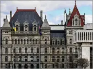  ?? HANS PENNINK, FILE — THE ASSOCIATED PRESS ?? A partial view of the New York state Capitol building, left, is shown next to the state Appellate court building in foreground, right, in Albany, N.Y.