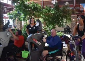  ?? MARIAN DENNIS — MEDIANEWS GROUP ?? The Spring Valley YMCA set up a group of cycling machines in its lobby Wednesday to help raise funds for their annual campaign. Visitors were encouraged to sign up for a duration on the bikes and help bolster donations.