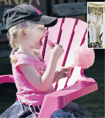  ?? PHOTOS: GERARD O’BRIEN ?? Pretty pink . . . Eating candyfloss at the Extravagan­za Fair is Georgia Dunning (3), of Dunedin.