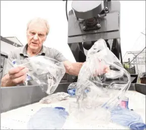  ?? MARK BRETT/Local Journalism Iniiative ?? Inventor Ron Ryde with some of the processed plastic product that will be chipped.