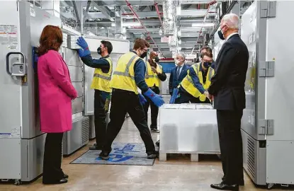  ?? Evan Vucci / Associated Press ?? President Joe Biden and Michigan Gov. Gretchen Whitmer tour a Pfizer manufactur­ing site Friday in Portage, Mich. Biden has set a goal of administer­ing 100 million shots in his first 100 days in office.