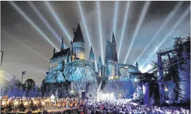  ?? ROBERTO GONZALES UNIVERSAL ORLANDO VIA TNS ?? “The Nighttime Lights at Hogwarts Castle” show uses projection mapping, special effects and light to bring the four houses of Hogwarts to life on most nights.