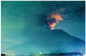  ??  ?? Mount Agung on the Indonesian island of Bali erupts early Sunday. The volcano began showing signs of activity in September, and the latest eruptions have disrupted