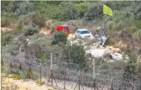  ?? (David Cohen/Flash90) ?? UNIFIL members patrol the border between Israel and Lebanon yesterday.