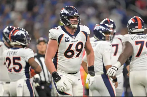  ?? RJ SANGOSTI — THE DENVER POST ?? Broncos offensive tackle Mike Mcglinchey makes a pained face after getting up slow and holding his leg during the second half against the Lions in Detroit on Dec. 16.