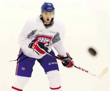  ?? JOHN KENNEY/ THE GAZETTE ?? Canadiens rookie Alex Galchenyuk keeps his eye on a flying puck at the Bell Sports Complex in Brossard during camp.