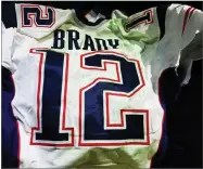  ??  ?? This photo released by MAGO on Tuesday shows Tom Brady’s Super Bowl LI jersey after it was recovered by authoritie­s in Mexico City.