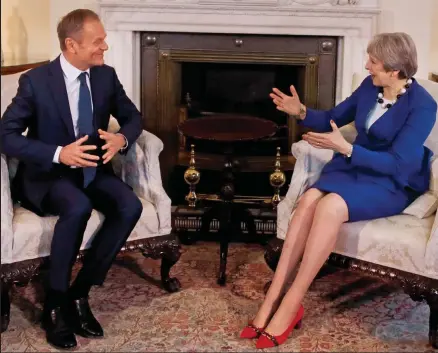  ??  ?? Seat of power: Theresa May chats with Donald Tusk at Downing Street yesterday