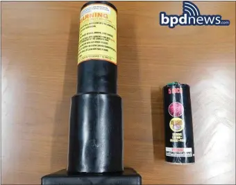  ?? COURTESY BOSTON POLICE DEPARTMENT, BPDNEWS.COM ?? TEEN TROUBLE: The black launch cylinder and a firework that police say they recovered from a backpack of a 16-year-old Quincy boy who was a part of a group of four facing juvenile fireworks charges.