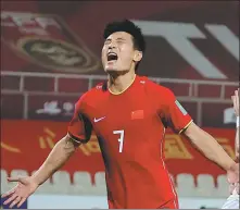  ?? AFP ?? Wu Lei celebrates scoring from the penalty spot to help Team China to a 3-1 World Cup qualifying victory over Syria on Tuesday.