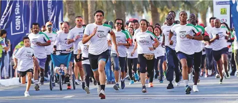  ?? Virendra Saklani/Gulf News ?? Residents of different age groups and nationalit­ies at the 10km Emirates NBD Unity Run at Dubai Silicon Oasis yesterday.