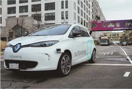  ?? STAFF FILE PHOTOS, ABOVE, BY NANCY LANE; AND TOP BY TED ANCHER ?? AUTO PILOT: A nuTonomy self-driving car performs a test drive in January, above. The company is seeking to expand its testing out of the Raymond L. Flynn Marine Park and into the Seaport area, top.