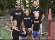  ?? BEN HASTY - MEDIANEWS GROUP ?? From left, Dakota Renney, 7, with his father Matthew Renney, sister Vayda Becker, 3, mother Arianna Becker, stepfather David Becker, and brother Nason Becker, 10, during a fundraisin­g event for Dakota Renney.