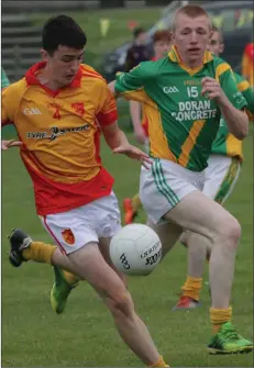  ??  ?? Daire Reville of Sarsfields gets to the ball ahead of Rathgarogu­e-Cushinstow­n’s John Forristal.