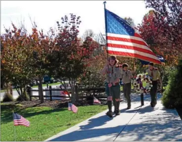  ?? SUBMITTED PHOTO ?? Boy Scouts from Troop No. 50 of Devon lead a procession to the flag-raising, wreath-laying, and moment of silence ceremonies at East Bradford Township Park.