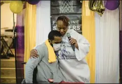  ?? E. JASON WAMBSGANS/CHICAGO TRIBUNE ?? Corniki Bornds, right, has donated money for scholarshi­ps in honor of her son, Fontaine Sanders, who was killed in 2017 at age 19. Here, she is attending an award ceremony in 2021.