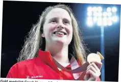  ??  ?? Gold medalist Sarah Vasey of England looks on during the medal ceremony for the Women’s 50m Breaststro­ke Final. (Photo by Clive Rose/Getty Images)