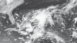  ?? AFP PHOTO /NOAA/NASA ?? A tropical depression is centered between Bermuda and the Bahamas on Friday.