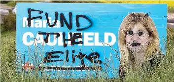  ??  ?? Graffiti and abuse: Tory MP Maria Caulfield, left, her vandalised hoarding, above, and Tory candidate Joy Morrissey, right