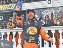  ?? THE ASSOCIATED PRESS ?? NASCAR driver Martin Truex Jr. celebrates in victory lane after winning Sunday’s Cup Series race in Long Pond, Pa.