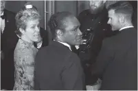  ?? THE ASSOCIATED PRESS ?? This image taken from video shows Oscar winner Frances McDormand, left, walking into the Governors Ball next to Terry Bryant, center, the man accused of stealing her Academy Award on Sunday.