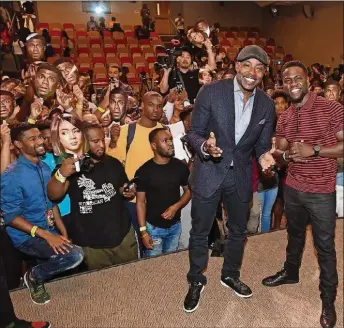  ??  ?? Kevin Hart (right) and Will Packer, executive producers of “Night School,” recently visited Morehouse College to promote Hart’s scholarshi­p program and the film.