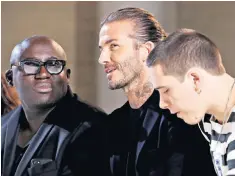  ??  ?? Front row: David and Brooklyn join Edward Enninful, editor of Vogue, in the front row