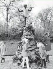  ?? ASSOCIATED PRESS ?? In 1969, children play around a statue of Peter Pan in London, the city where the play opened.