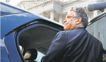  ?? JACQUELYN MARTIN/AP ?? Sen. Al Franken, D-Minn., leaves the Capitol on Thursday after announcing on the Senate floor that he would step down.