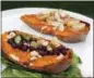  ?? MELISSA D’ARABIAN VIA AP ?? Two halves of a sweet potato prepared with savory and sweet toppings.