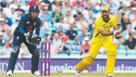  ?? Picture: AFP ?? England’s Jos Buttler watches as Australia’s Glenn Maxwell attacks during the first ODI clash at The Oval.