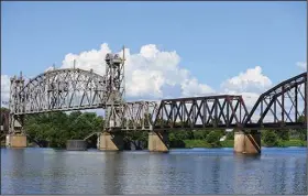  ??  ?? A grant will help pay for repairs that include an Arkansas River railroad lift bridge and multiple wooden trestles along a rail line from Fort Smith to Missouri.
(Arkansas Democrat-Gazette/Thomas Saccente)