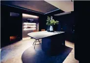  ?? ?? The centrepiec­e of the place is the kitchen island counter, which boasts a built-in wine cooler at the bottom and a concrete top. “It allows my bonsai or a vase of eucalyptus to perch majestical­ly,” she adds.