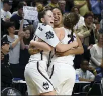  ?? JESSICA HILL — THE ASSOCIATED PRESS ?? From left, UConn’s Katie Lou Samuelson, Napheesa Collier and Kyla Irwin celebrate as the clock winds down on Monday.