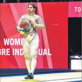  ?? TWITTER ?? India’s Bhavani Devi steps out to compete in her Tokyo Olympics first-round individual sabre match against Tunisia’s Nadia Ben Azizi in Chiba, Japan, on Monday.