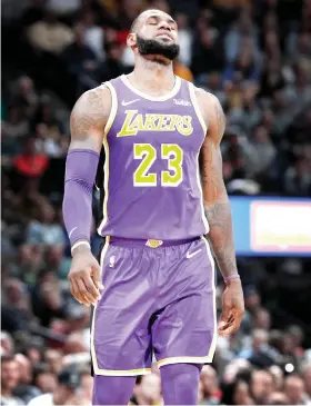  ?? AP FOTO ?? BAD DAY AT THE OFFICE. Los Angeles Lakers forward LeBron James is limited to just 14 points by the Denver Nuggets.