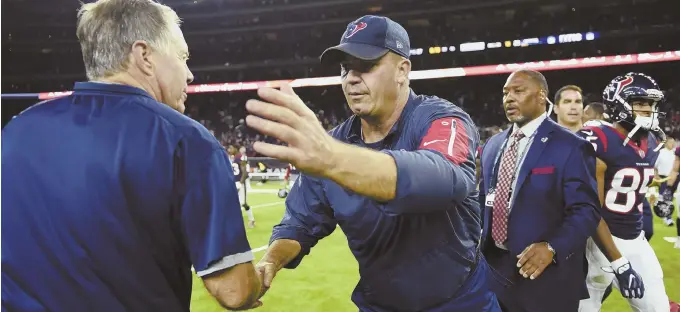  ?? AP PHOTO ?? OLD FRIENDS: Bill Belichick (left) and former Pats assistant Bill O’Brien shake hands after the Texans’ 27-23 preseason victory last night in Houston.