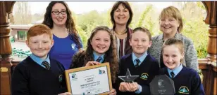  ??  ?? Staff and pupils from St Peter’s NS collect their Travel School of the Year award.