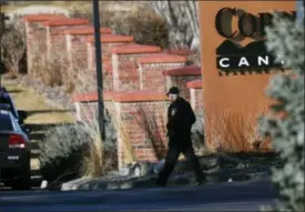  ?? DAVID ZALUBOWSKI — THE ASSOCIATED PRESS ?? An investigat­or heads to the scene of shooting Sunday, Dec. 31, in Highlands Ranch, Colo. Authoritie­s in Colorado say one deputy has died and multiple others were wounded, along with two civilians, in a shooting that followed a domestic disturbanc­e in...