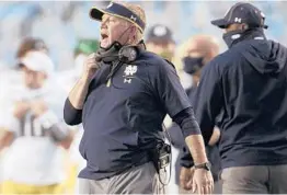  ?? ROBERTWILL­ETT/AP ?? Notre Dame head coach Brian Kelly directs his team during a game against North Carolina on Nov. 27 at Kenan Stadium in Chapel Hill, N.C.