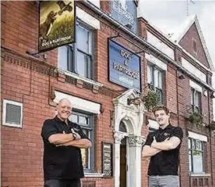  ??  ?? ●●Licensee Andy Green and his son Jason outside the new Dog and Partridge, in Great Moor