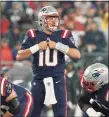  ?? Steven Senne / Associated Press ?? Patriots quarterbac­k Mac Jones (10) signals from the line during the first half against the Buccaneers on Sunday in Foxborough, Mass.