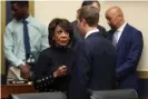  ?? Photograph: Chip Somodevill­a/Getty Images ?? Maxine Waters talks with Mark Zuckerberg after he testified.