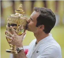  ?? AP PHOTO ?? SWEET: Roger Federer celebrates after winning his eighth Wimbledon title yesterday.