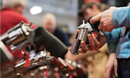  ?? Photograph: Bloomberg/Getty Images ?? Gun owners at an NRA meeting in Nashville. A separate bill would allow 18-year-olds in Tennessee to apply for concealed-carry licenses.