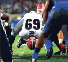  ?? KEN WARD / For the Calhoun Times ?? Georgia’s Trent Frix (center) snaps the ball on a field goal attempt during Saturday’s game at Kentucky.