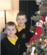  ??  ?? Olly and Jack Gardiner with their elf