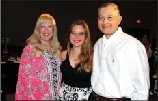  ?? NWA Democrat-Gazette/CARIN SCHOPPMEYE­R ?? Caroline Elser (center), and her parents Janell and Mark Elser attend Laugh Out Loud.
