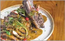  ?? Jakob N. Layman ?? ATRIUM on Vermont Avenue features a rib-eye steak with a Szechuan au poivre by executive chef Hunter Pritchett.
