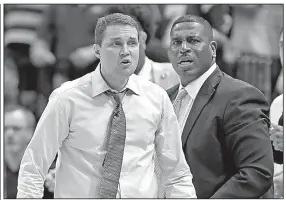  ?? AP/BILL FEIG ?? LSU head Coach Will Wade (left) has been suspended indefinite­ly by LSU after he was alleged to be on a wiretap discussing an offer for Javonte Smart. Assistant coach Tony Benford (right) is serving as the Tigers coach in the interim.